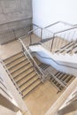 Empty room with stairs and silver banister in modern office