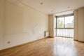 An empty room with walls full of marks from the old furniture and a bay window with curtains at the bottom Royalty Free Stock Photo