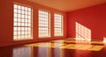 Empty room with large windows casting geometric sunlight patterns on the floor and red walls Royalty Free Stock Photo
