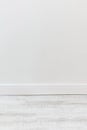Empty room with white cement wall texture and white wooden floor pattern. Royalty Free Stock Photo