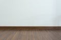 Empty room, white mortar wall background and wood laminate floor Royalty Free Stock Photo