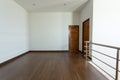 Empty room, white mortar wall background and wood laminate floor Royalty Free Stock Photo