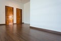 Empty room, white mortar wall background and wood laminate floor Royalty Free Stock Photo