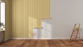 Empty room with white walls and parquet floor, shits of striped yellow wallpaper on the wall with copy space. Housework concept Royalty Free Stock Photo