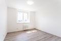 empty room with white walls and window in a new building, apartment for rent Royalty Free Stock Photo