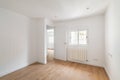 Empty room with window and hardwood floor after renovation. New apartment for rent or sale. Royalty Free Stock Photo