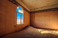 Empty room with a window and sand in the ruined ghost town Kolmanskop, Namibia