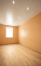 Empty room with window and turned on lights on the ceiling Royalty Free Stock Photo