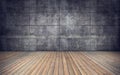 Empty room with wooden floor and concrete tiles wall