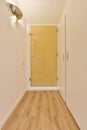 a door to a room with a wooden floor and Royalty Free Stock Photo