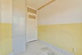 a room with yellow and white walls and a door Royalty Free Stock Photo