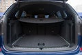 Empty roomy open trunk of modern crossover car, copy space, Rear view of a car with an open trunk, close up, soft focus