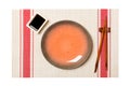 Empty round brown plate with chopsticks for sushi and soy sauce on sushi mat background. Top view with copy space for you design Royalty Free Stock Photo