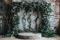 Empty round concrete podium for product presentation with flowered wall background Royalty Free Stock Photo