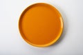 Empty round orange ceramic plate