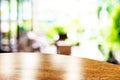 Empty round table top at coffee shop blurred background with bokeh light,Template mock up for display of your product. Royalty Free Stock Photo