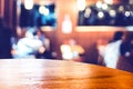 Empty round table top at coffee shop blurred background with bokeh light,Template mock up for display of your product. Royalty Free Stock Photo