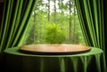Empty round wooden table and green curtain with forest background. Royalty Free Stock Photo