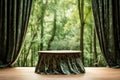 Empty round wooden table and green curtain in green forest background Royalty Free Stock Photo