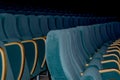 An empty row of green chairs with wooden arms, an auditorium deserted by people. Royalty Free Stock Photo