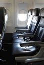 Empty Row of Seats on a Commercial Airliner Jet Royalty Free Stock Photo