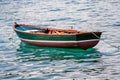 Empty rowing boat floating in the water.