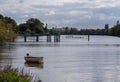 Empty rowing boat on the River Thames, photographed at Strand on the Green, Kew, London UK