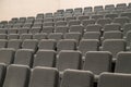 Empty rows of comfortable grey seats cinema or theater Royalty Free Stock Photo