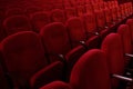 Empty rows of red theater or movie seats, side view Royalty Free Stock Photo