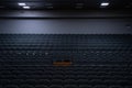 Empty rows of seats in the hall for a large number of people. Cinema and theatre hall for watching performances. Royalty Free Stock Photo