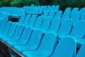 Empty rows of seats in the stadium. Blue and yellow chairs, nobody present at a sport show simple abstract concept Royalty Free Stock Photo