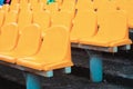 Empty rows of seats in the stadium. Blue and yellow chairs, nobody present at a sport show simple abstract concept Royalty Free Stock Photo