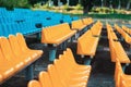 Empty rows of seats in the stadium. Blue and yellow chairs, nobody present at a sport show simple abstract concept Royalty Free Stock Photo