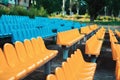 Empty rows of seats in the stadium. Blue and yellow chairs, nobody present at a sport show simple abstract concept Royalty Free Stock Photo