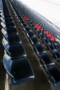 Empty Rows of stadium grandstand seats or stadium seats, plastic blue and red seats on grand stadium pattern. Royalty Free Stock Photo