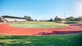 Empty running track, arena or stadium architecture for marathon race, sports cardio training or fitness workout. Blue Royalty Free Stock Photo