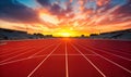 Empty Running Track in Stadium with Vibrant Sunset Sky, Inviting Atmosphere for Sports and Athletics Royalty Free Stock Photo