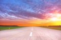 Empty runway with evening dawn sunset bright sky