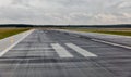 Empty runway at the passenger airport in the rain