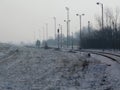 Almost empty rural train station on a wintry day with snow Royalty Free Stock Photo