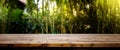 Empty rustic old wooden boards table copy space with bamboo plants forest in background. Product display template. Generative AI Royalty Free Stock Photo