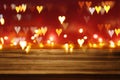 Empty rustic table in front of Valentine's day romantic glitter bokeh background with many hearts lights. Ready for product. Royalty Free Stock Photo