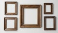 Empty Rustic Wooden Picture Frames on White Wall Royalty Free Stock Photo