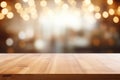 Empty rustic wooden table against a backdrop of blurred lights