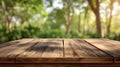 Empty Rustic Wooden Table Top with Blurred Green Forest Background for Product Display Mockup Royalty Free Stock Photo