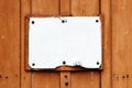 Empty vintage rustic rusty cracked and grungy white signboard in rectangular shape weathered under the elements