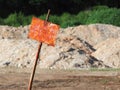 Empty rusty sign with soft soil in background