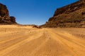 Dirt road Tadrart mountains. Sahara Algeria, Africa Royalty Free Stock Photo