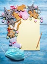 Empty Santa letter with Christmas traditional ginger cookies around it on wooden background. Christmas or New Year holiday