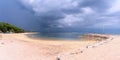 Almost empty Sanur beach when heavy rainy clouds coming, panorama photo of Sanur beach, Bali, Indonesia